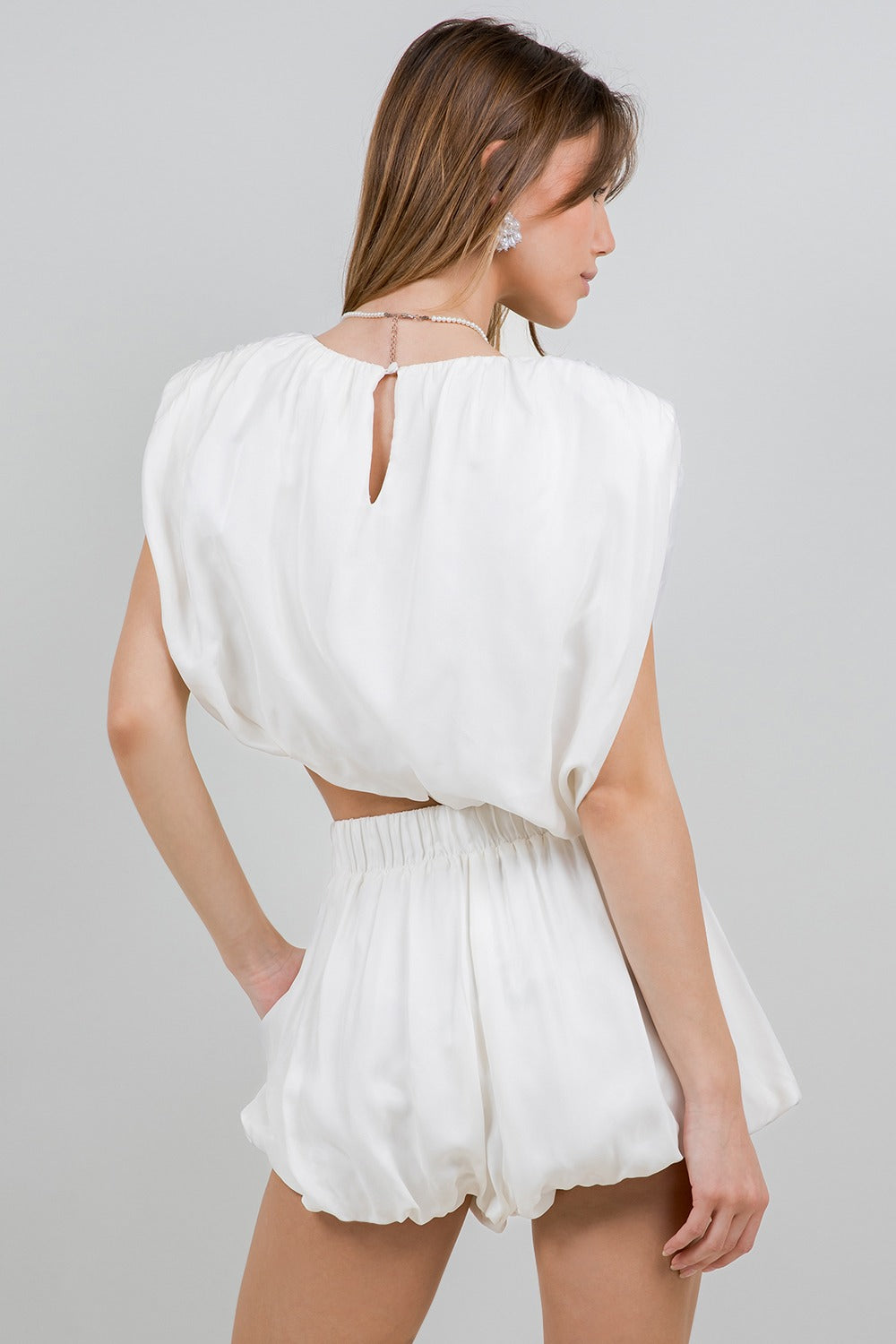 WHITE ASYMMETRICAL HEMMED WITH SHOULDER PAD WOVEN TOP
